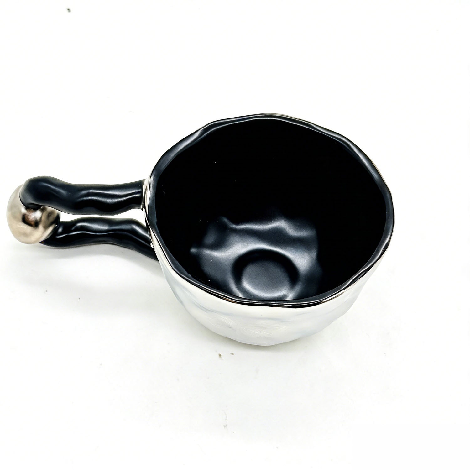 Ceramic cup with butterfly design and irregular rim 3