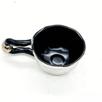 Ceramic cup with butterfly design and irregular rim 3