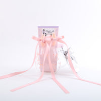 Glass cup gift with pink ribbon bows and silver hair clips, three-piece set