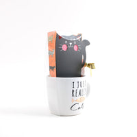 Cat ceramic mug with gift box sleeve and gold ribbon, white mug showing 'I JUST REALLY Cats'