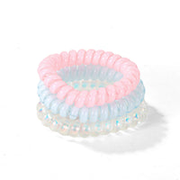 Pair of spring hair ties: pastel pink and blue with iridescent sheen