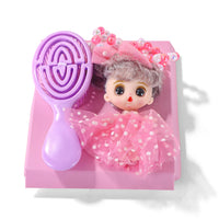 Doll figure with pink outfit holding a purple maze-shaped accessory