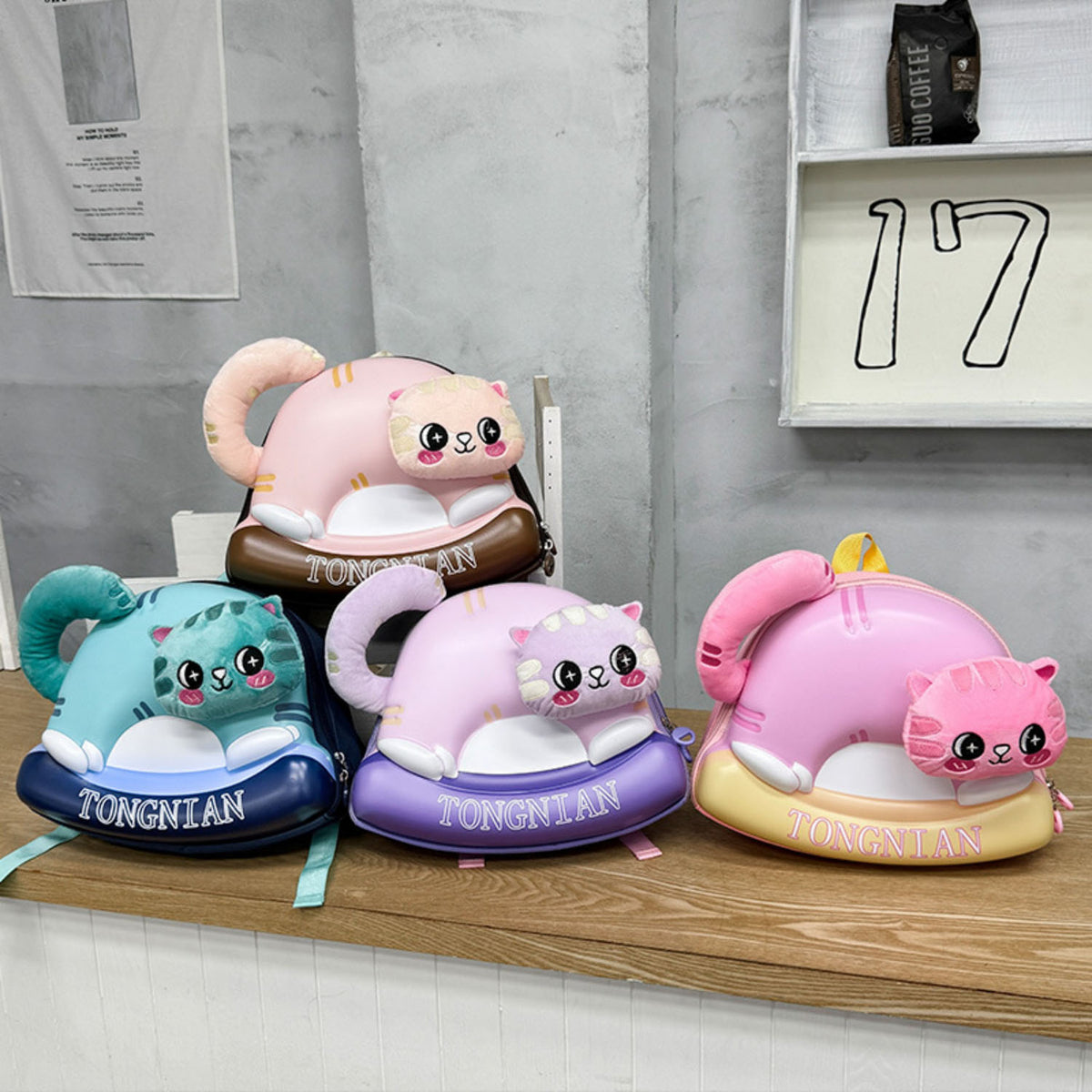 Kids eggshell-shaped plush backpack set in pink, blue, teal, and purple with bear face