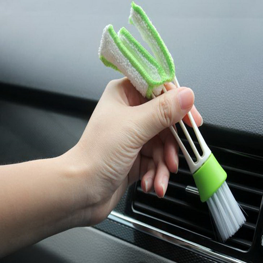 Car cleaning brush with green scrub pad head and white bristles on PP handle