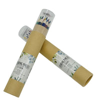 Colored pencil rolls in cardboard sleeves with clear covers, sharpened tips visible