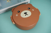 Large plush bunny toy top view, brown round case with bunny face