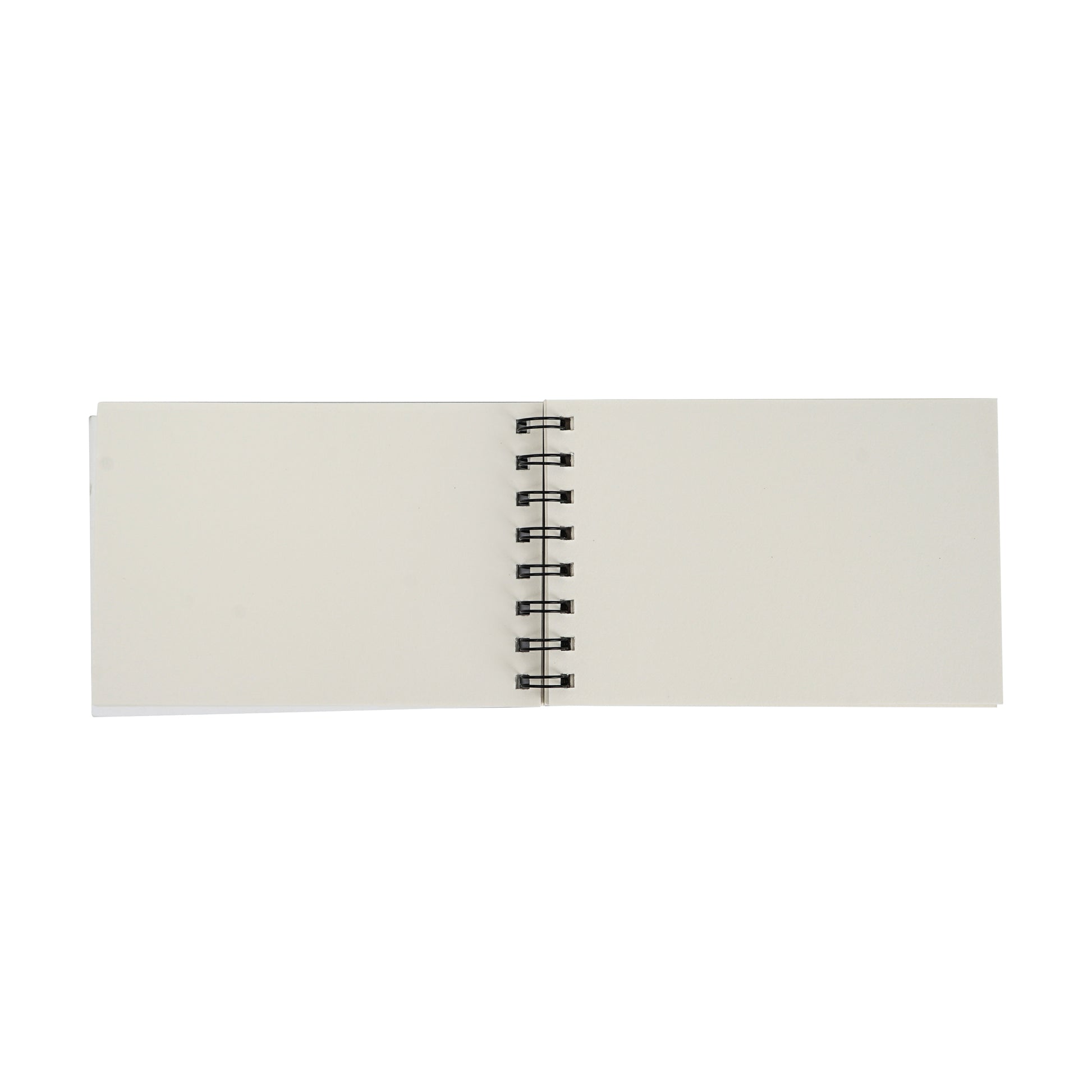 Small spiral notebook open view with blank pages and black spiral binding