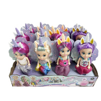 Unicorn-themed kid dolls in a box, multiple girls with unicorn horns and glitter outfits
