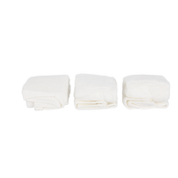 White facial cleansing cloths shown as three folded packs