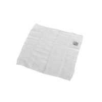 White facial cleansing cloth, folded with visible stitching and texture