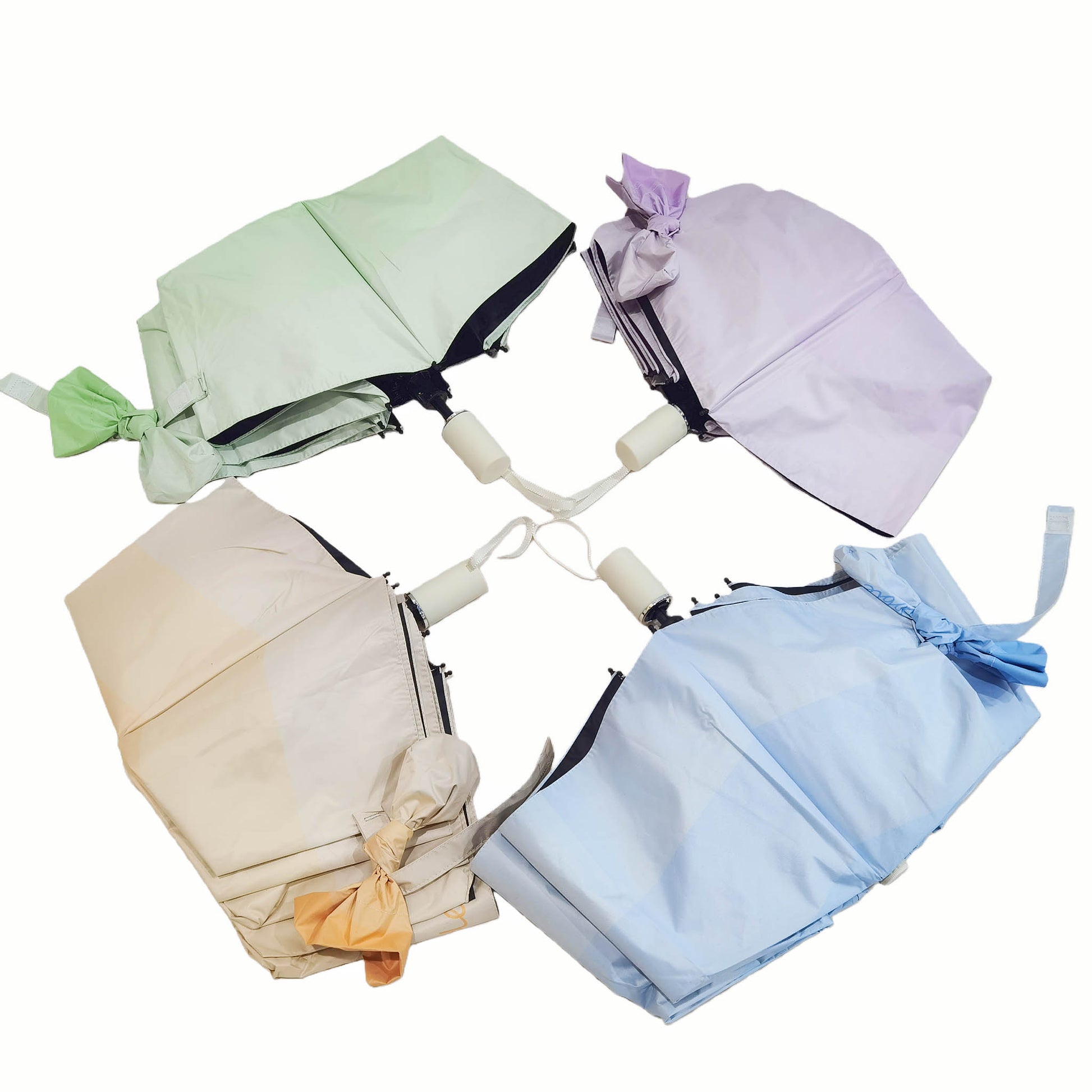 Assorted color folding umbrellas set: light green, purple, beige, and light blue