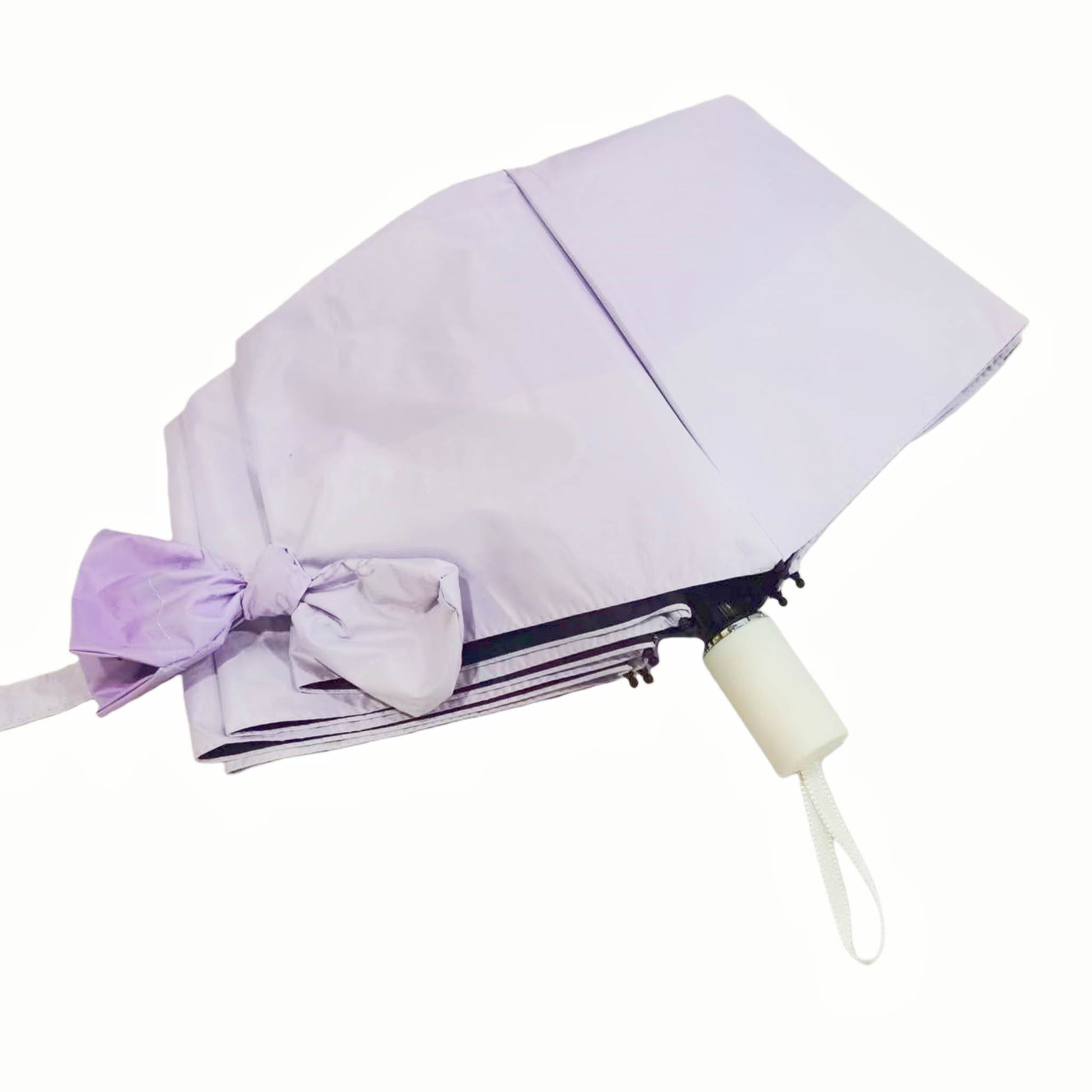 Folding umbrella, light purple canopy with ribbon tie and cream handle.