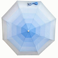 Light blue folding umbrella with bow detail and circular center joint, open