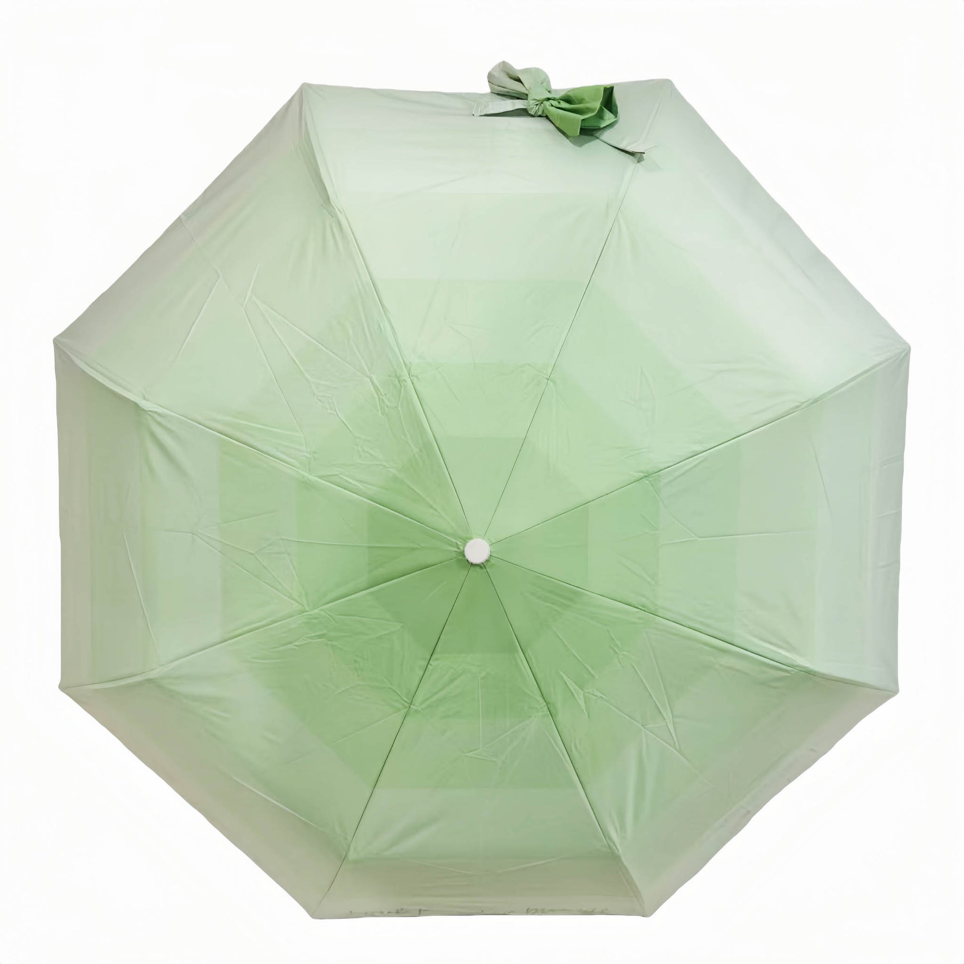 Folding umbrella, pale green canopy with tied bow on top and centered hub.