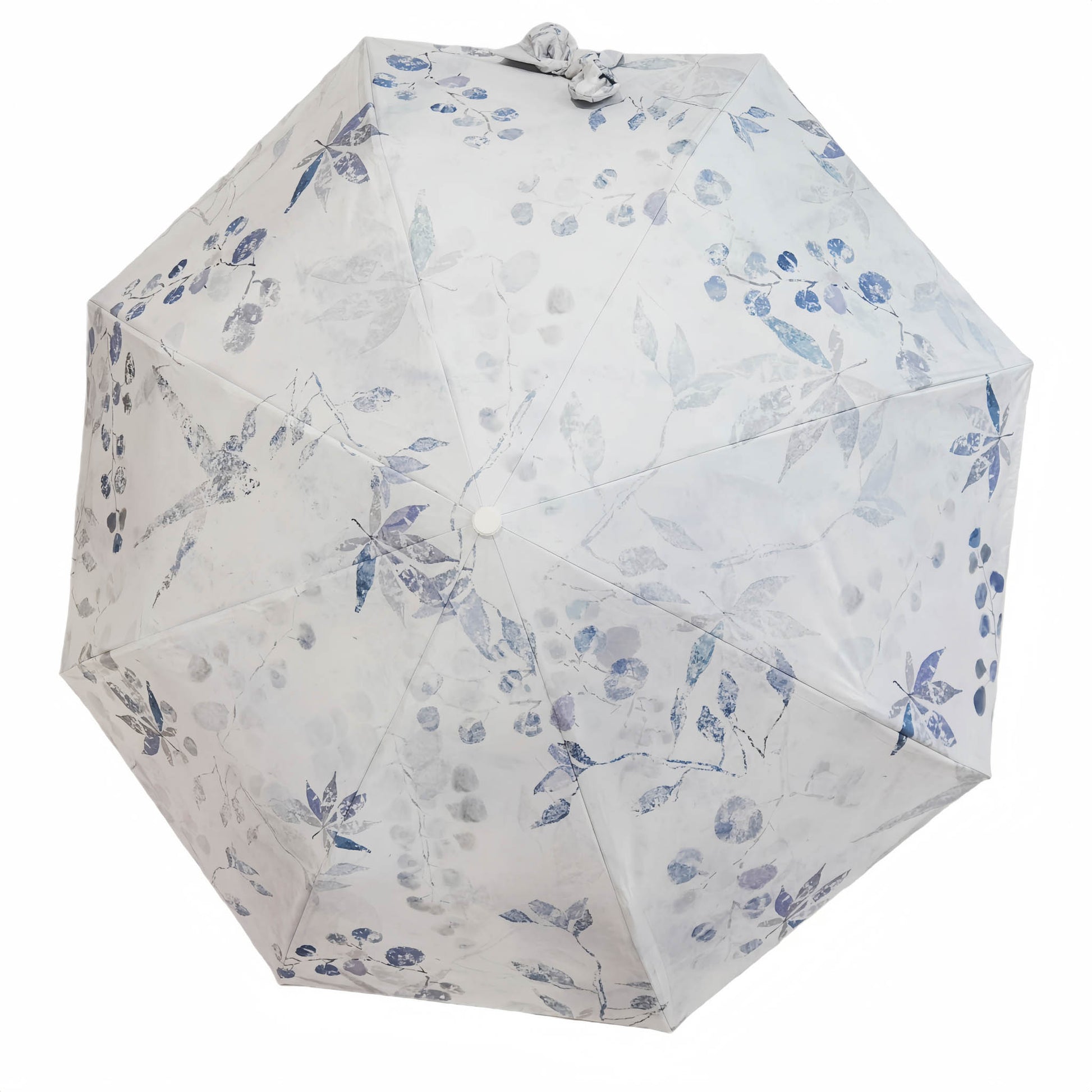 Folding umbrella with white fabric and blue floral pattern, round button center