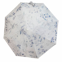 Folding umbrella with white fabric and blue floral pattern, round button center