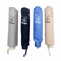 Set of folding umbrellas in gray, navy, blue, and beige with cartoon print