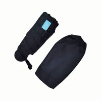 Folding umbrella in black cover, folded canopy with wrist strap