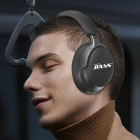 Black over-ear headphones worn by a person, padded ear cups and headband