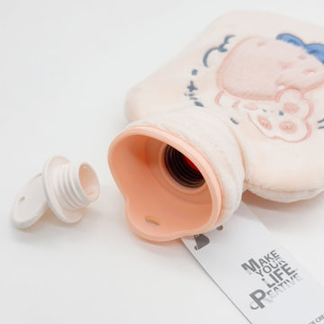 Plush rabbit hot water bag, light beige with embroidered rabbit and blue details
