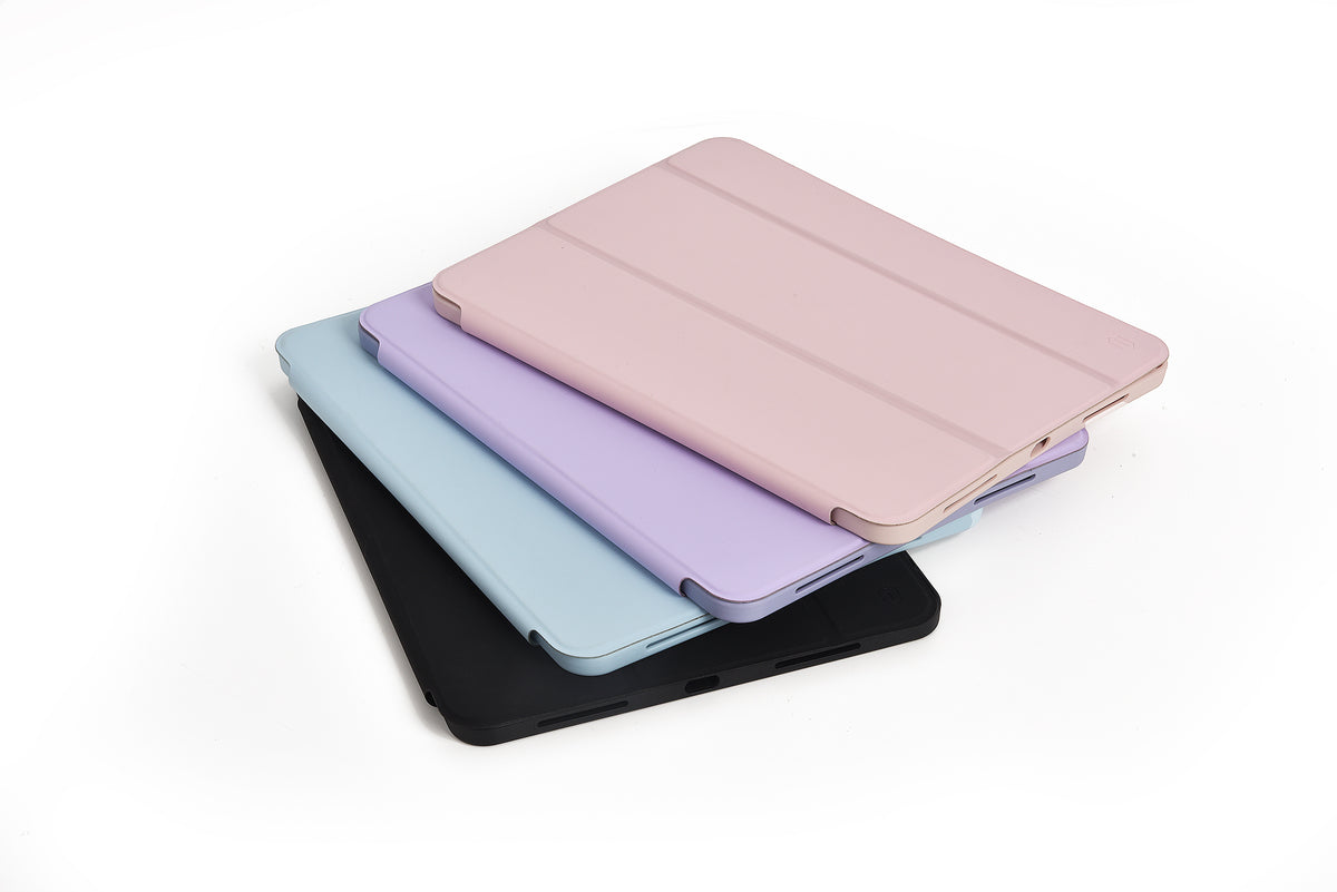Tablet case with stand and pencil holder, stacked covers in black, blue, and pink