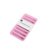 Silicone ice cube tray showing “ice making mould” label and pink molds