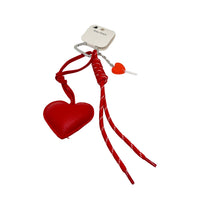 Red heart key chain with two heart charms, braided red cords, and metal clasp