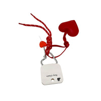 Red heart key chain with metal clip and square tag, plus small heart charm