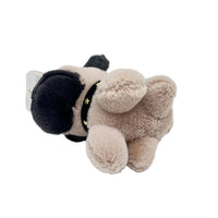 Plush dog keychain with tan body, dark hood-like patch, and star collar