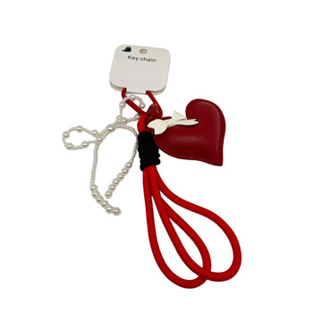 Red heart leather key chain with bow charm and dangling tassel cords