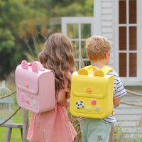 Pink and yellow silicone kids backpacks with front flap pockets, worn by children