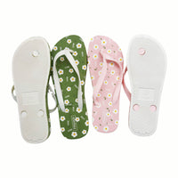 Ladies assorted flip-flops showing green, pink, and white soles with floral prints