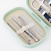 Manicure tool set in mint plastic case with beige pouches and metal nail tools