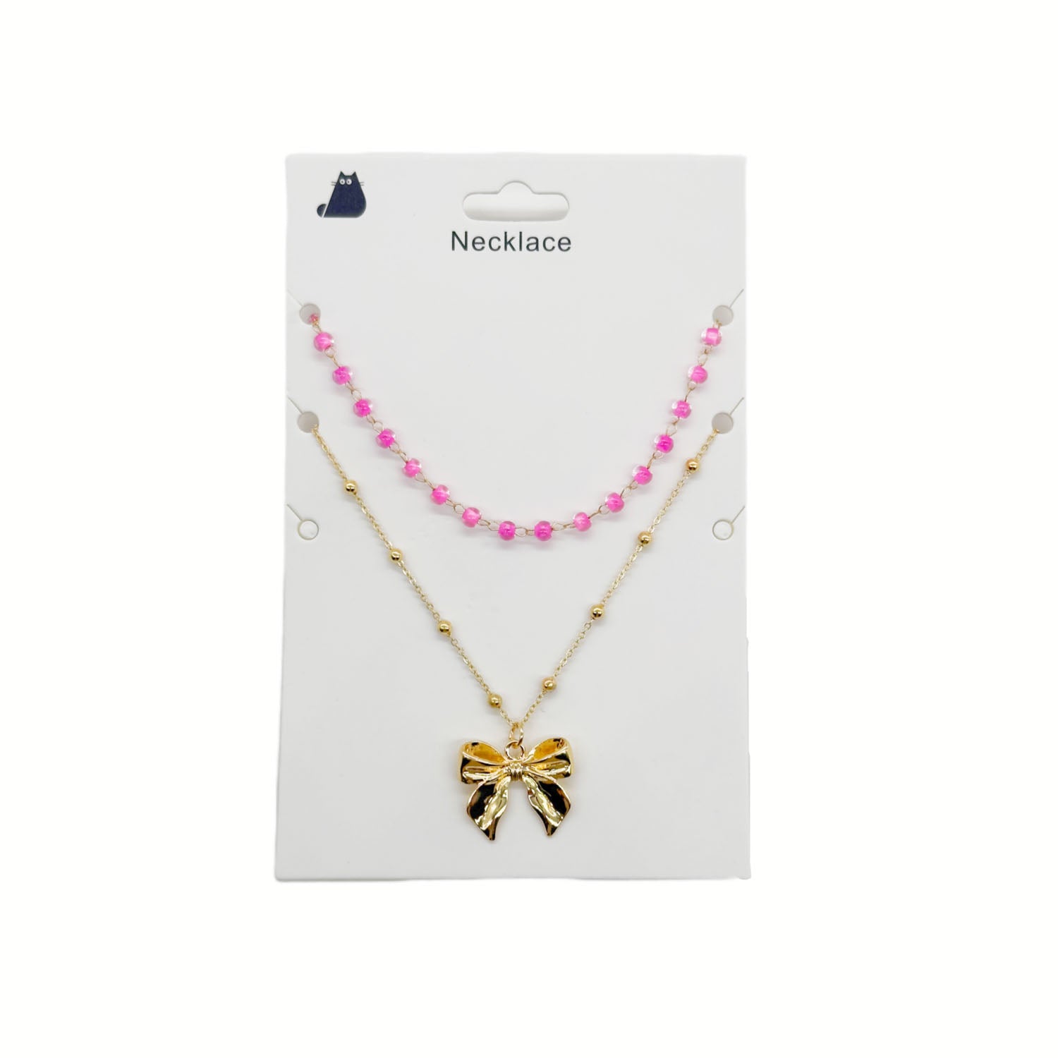 Gold necklace with pink bead accents and bow charm pendant