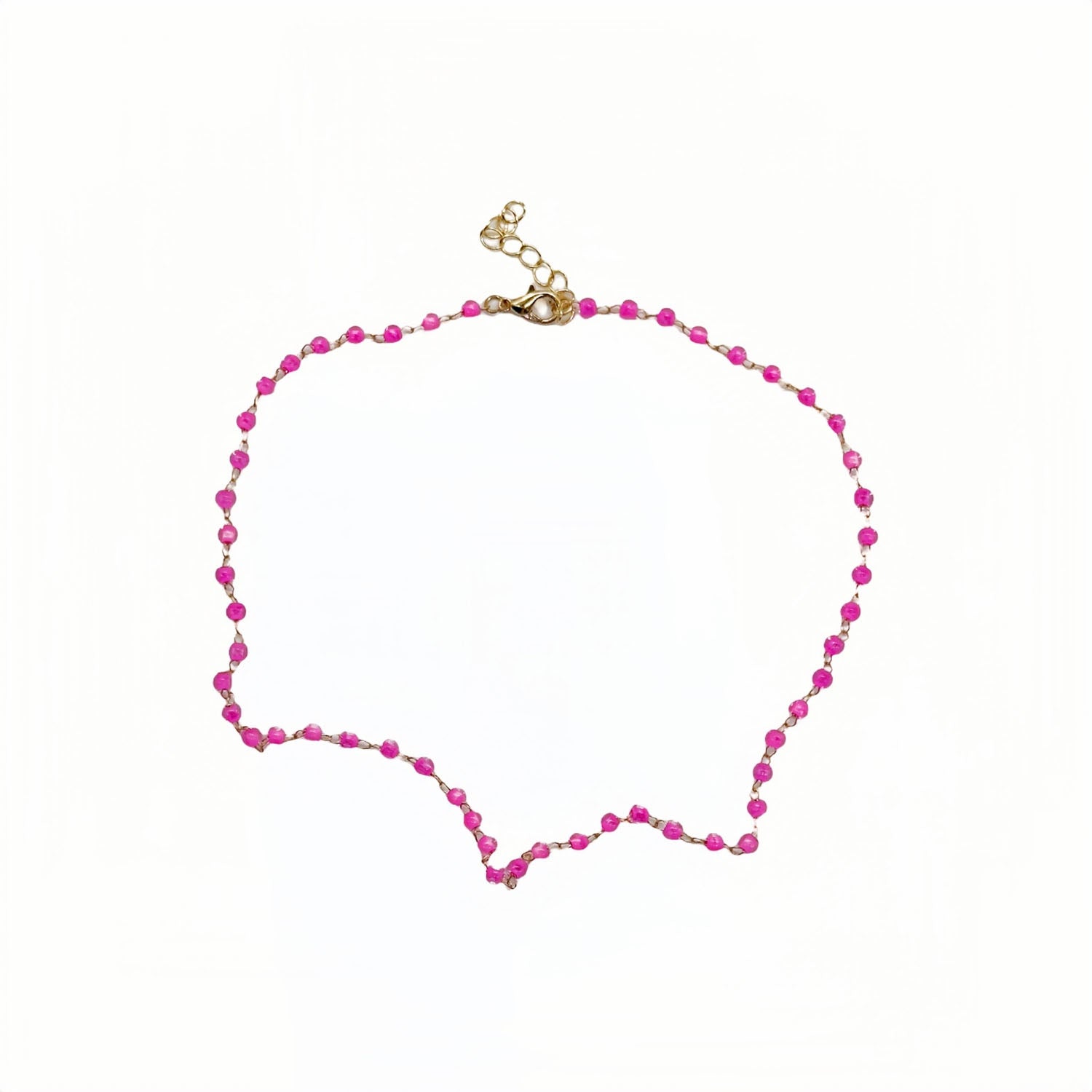 Gold necklace with pink bead strand and clasp at top