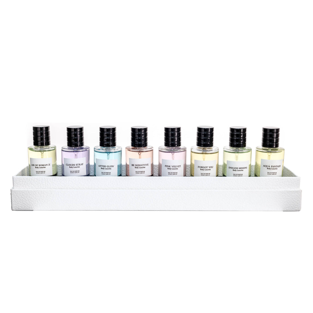 Perfume sample set of eight 20 ml bottles on white display tray