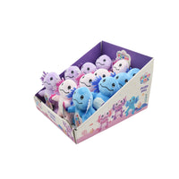 Plush toy doll assortment in an open box with purple, pink, and blue figures inside