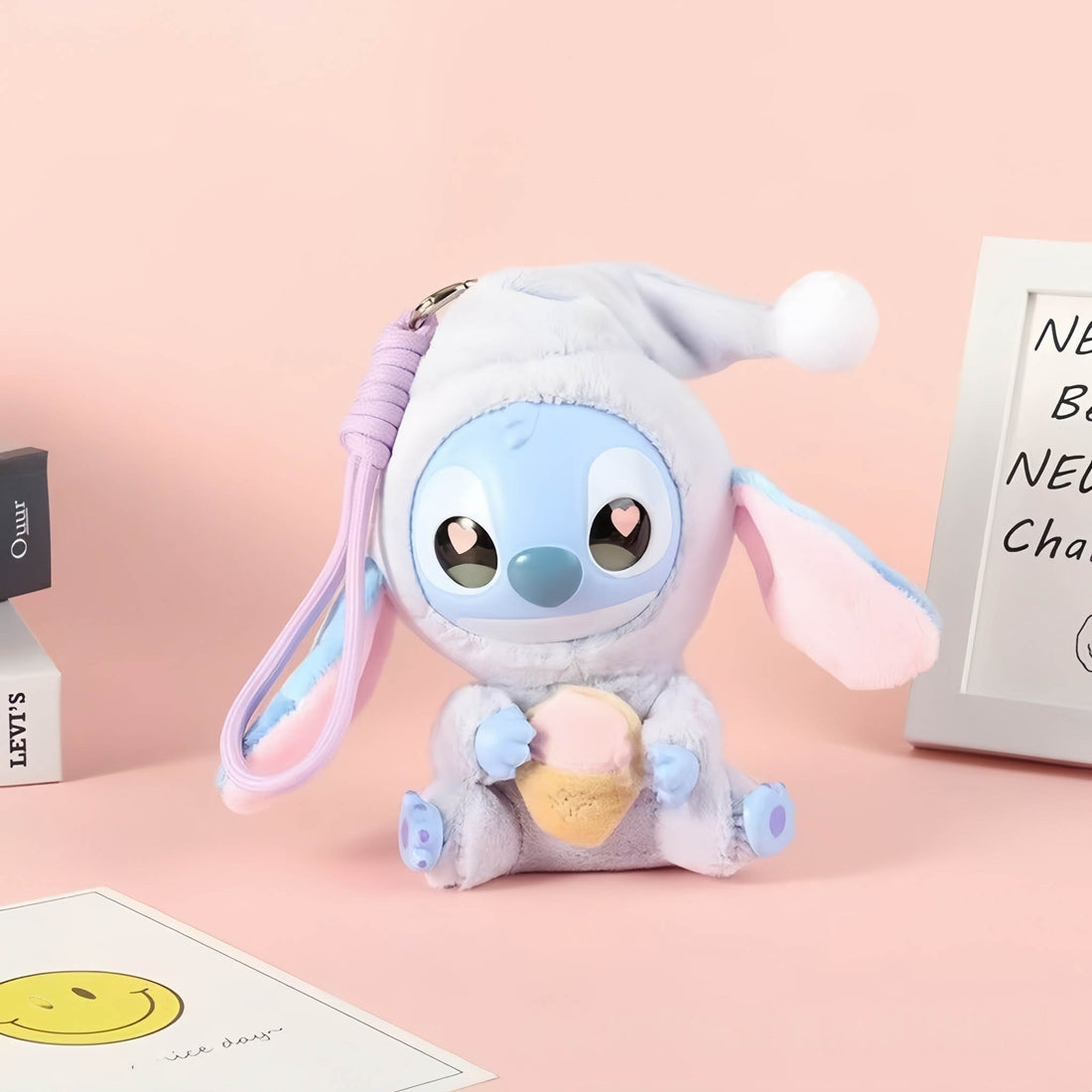 Stitch plush pendant, light blue character with white pom hood and blue strap loop