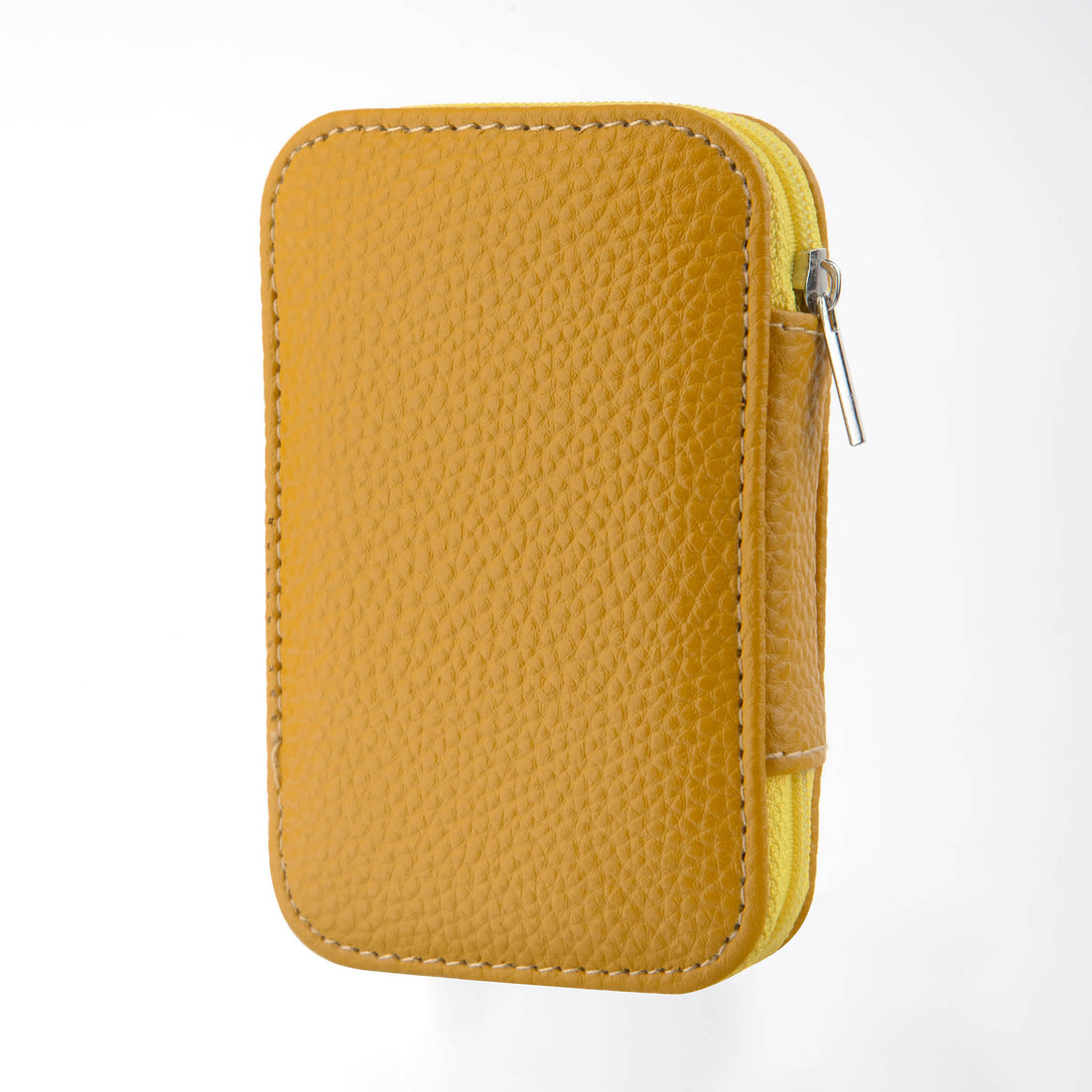 Yellow zippered sewing kit pouch with textured cover and metal zipper pull