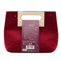 Burgundy felt pouch with cream label panel, Bloom glowing skin set ingredient info