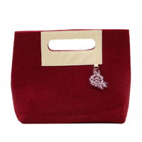 Burgundy felt pouch with cream handle and attached floral charm, Bloom glowing skin set