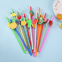 4-piece colorful fruit-top drink straw set with striped straws and cutout decorations.