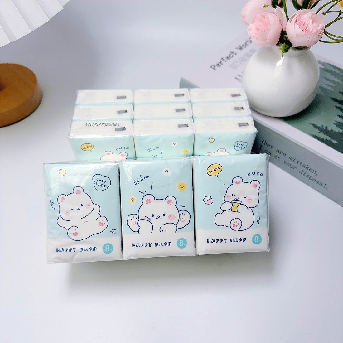 Mini paper handkerchief packs with cute bear faces, blue and pastel pink