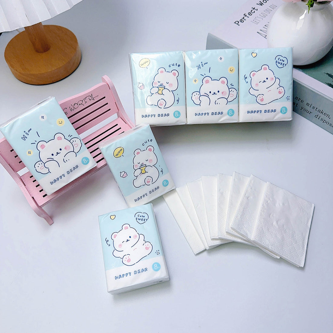 Paper handkerchief packs and folded sheets, blue bear design in pastel tones