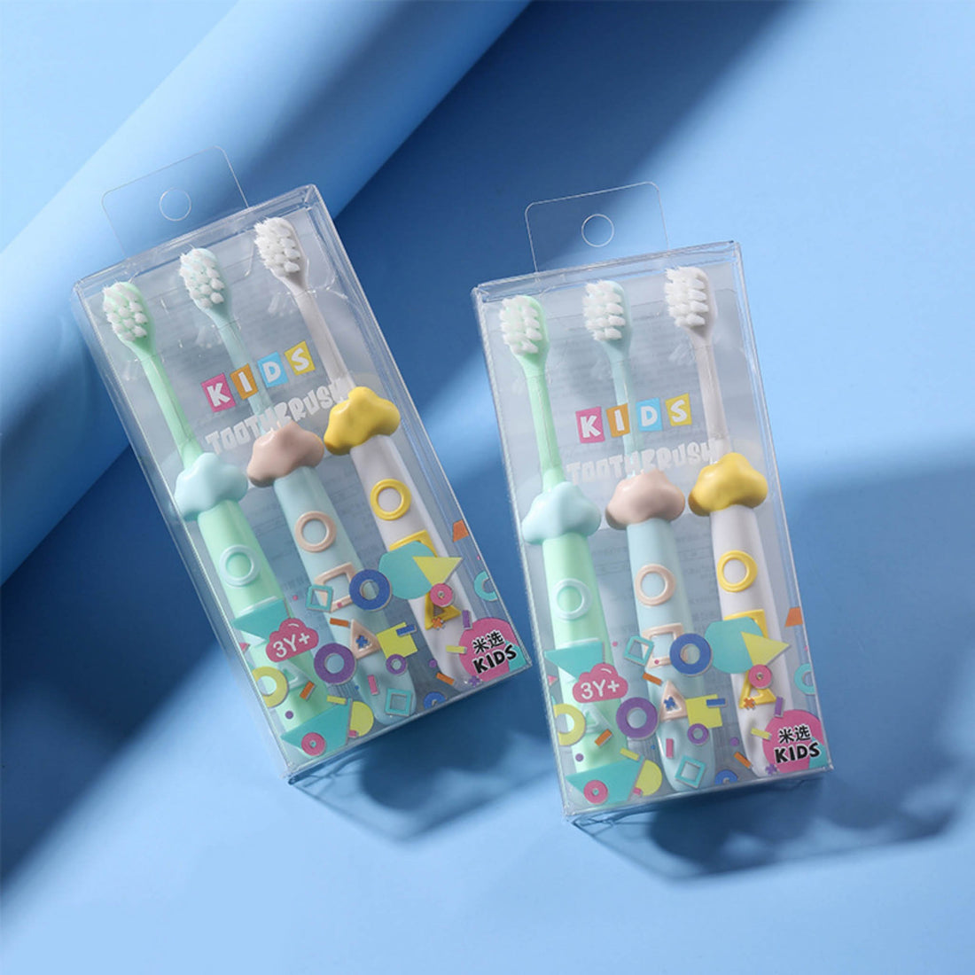 Kids 3-piece toothbrush set in clear plastic pack with colorful accents