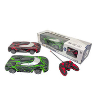 Remote control racing car set with green and red cars, controller, and box