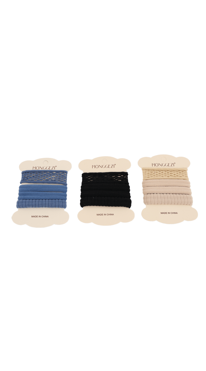 Assorted fabric hair ties in blue, black, and beige