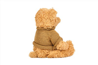 Knitted teddy bear lying pose, brown sweater with folded collar, tan plush