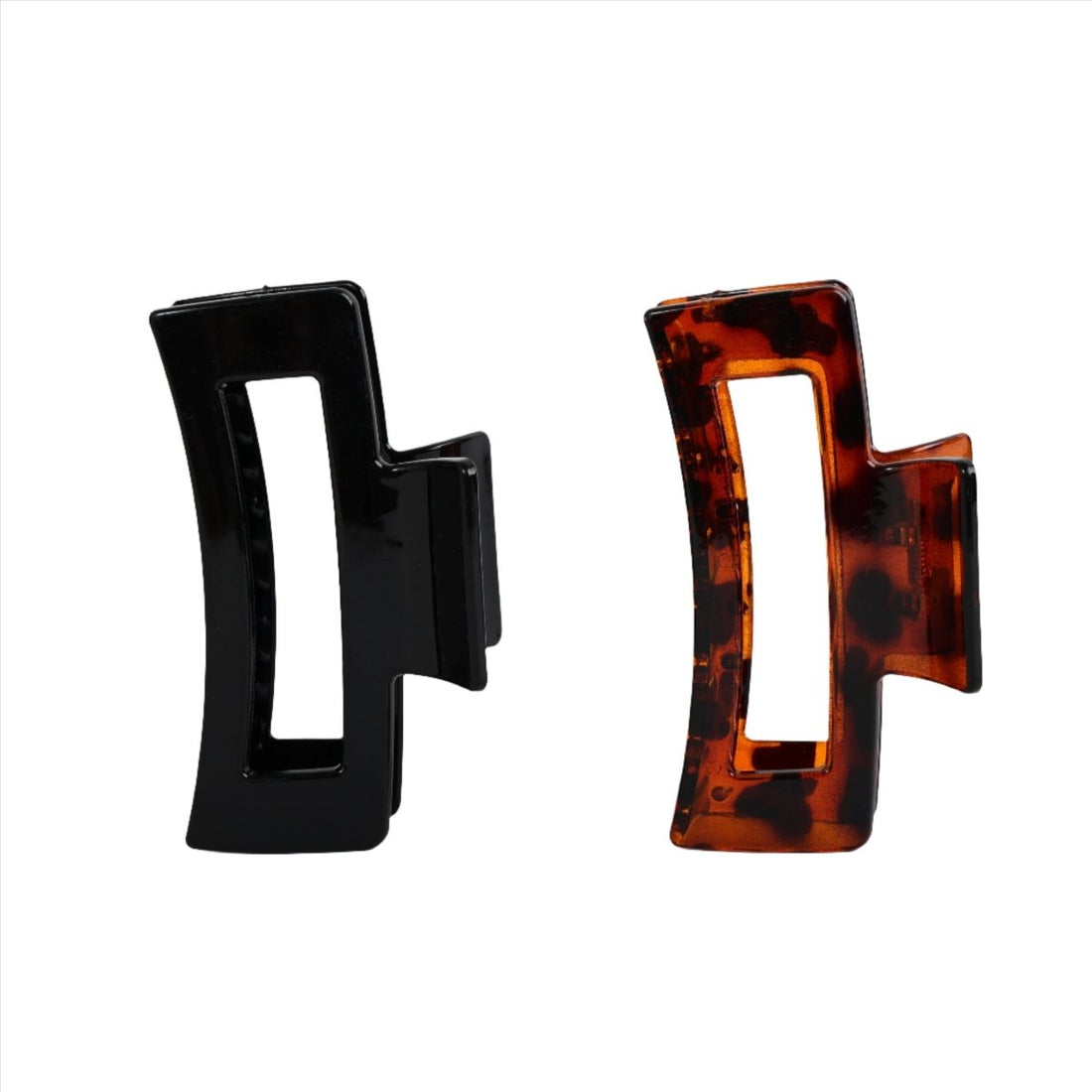 Adult claw clips, black and brown; side profile hinge with open teeth.