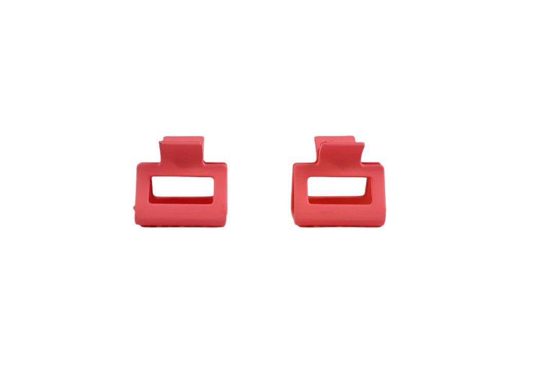 Pair of small pink snap hair clips with rectangular claw teeth